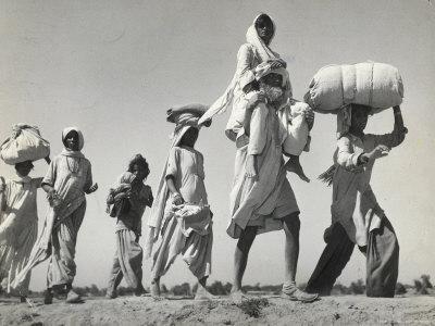 margaret-bourke-white-sikh-carrying-his-wife-on-shoulders-after-the-creation-of-sikh-and-hindu-section-of-punjab-india_u-l-p43kgb0.jpg